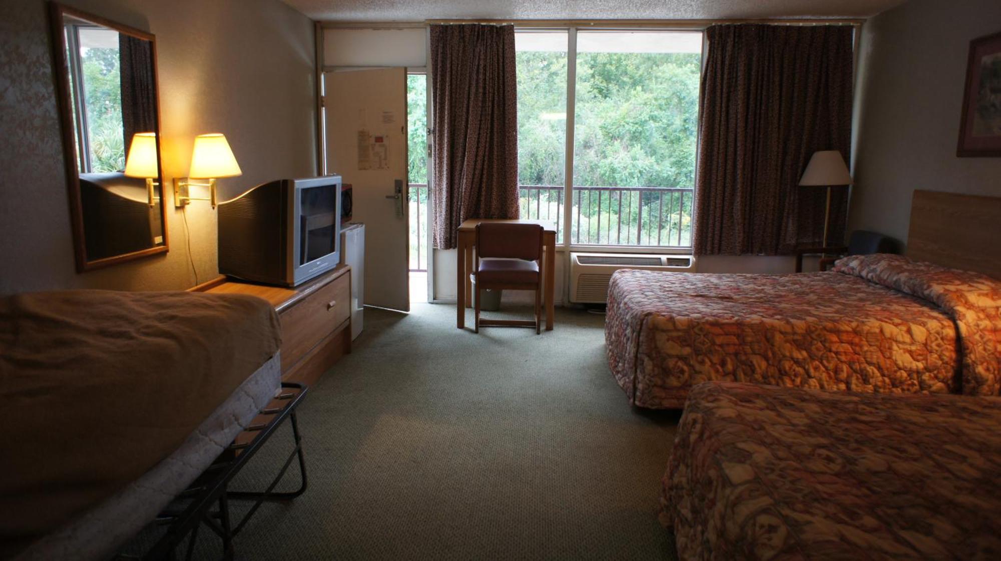 Executive Inn & Suites Orange Habitación foto